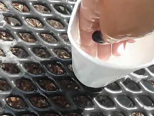 old man fists tight teen cup on public park bench